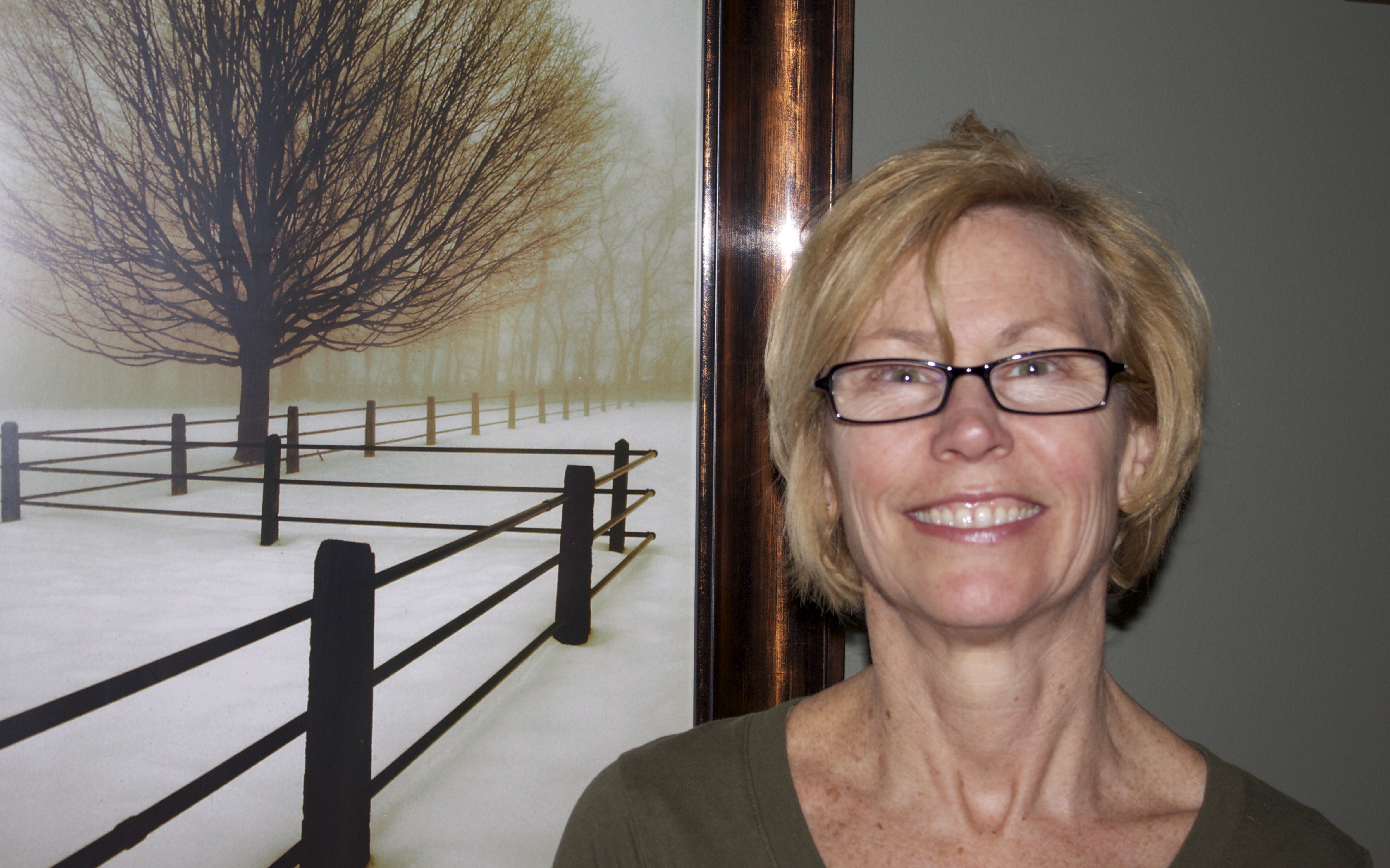 Jill Elaine Prim smiling beside a winter landscape